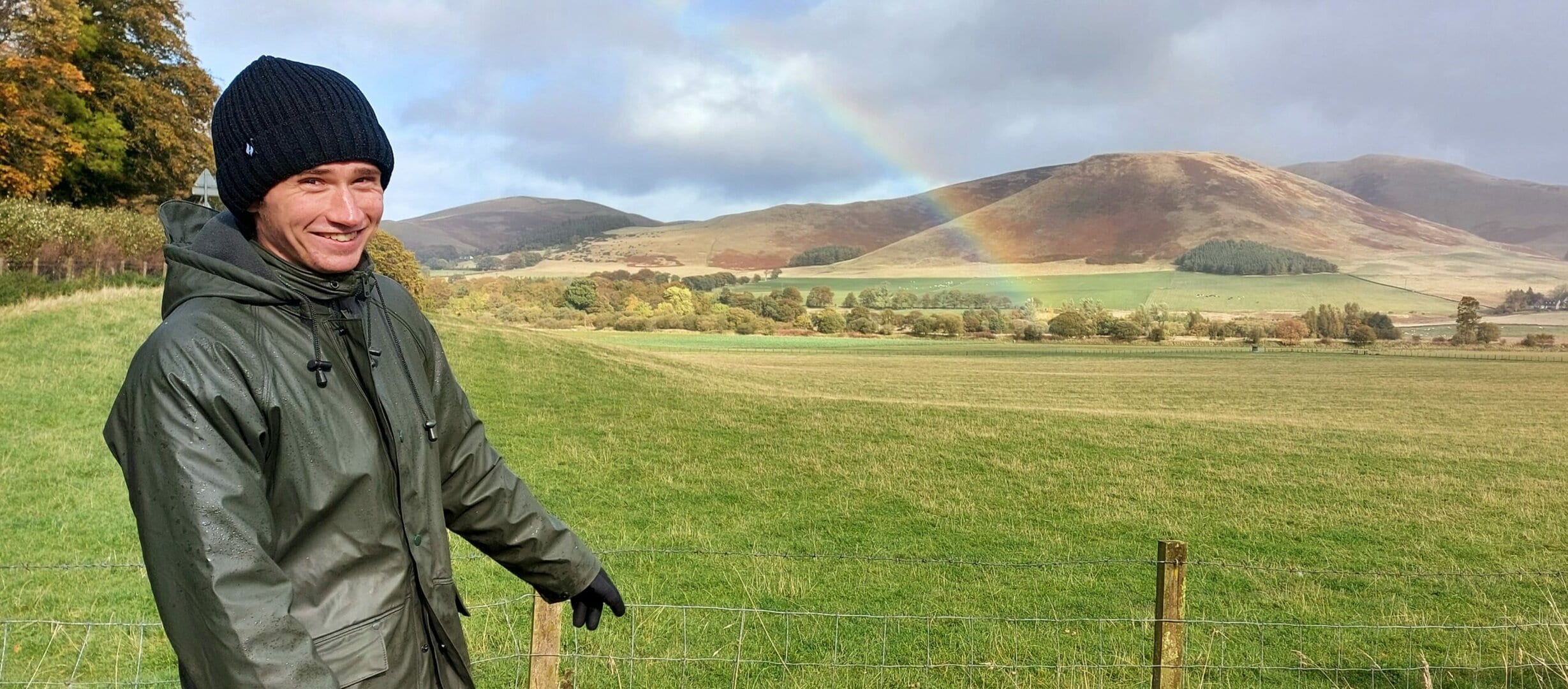 Rob pointing to the rainbow